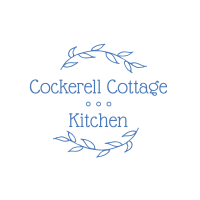 Cockerel Cottage Kitchen logo with plant vines creating the upper and lower boundaries encircling the business name, all in blue